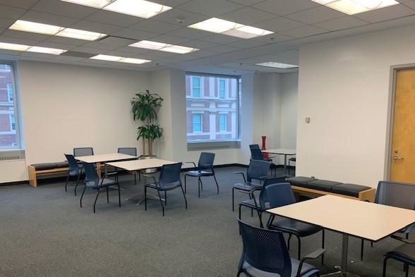 The student lounge on the fourth floor of Warren Hall was refreshed with new carpeting, fresh paint, LED lighting, and new TVs. A student lounge room with several tables and chairs inside