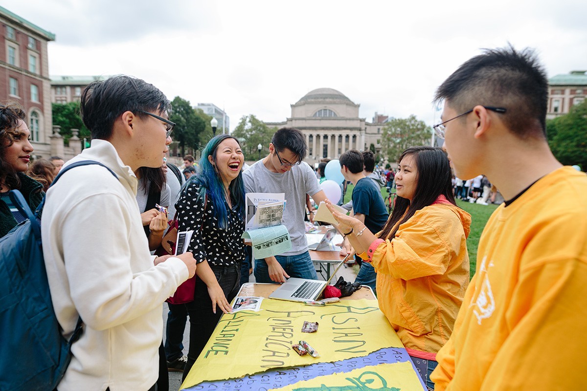 Students laughing at an event on Morningside Campus