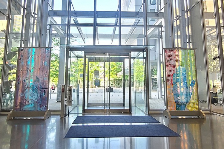 The two colorful custom pieces on display in the JLG Science Center lobby on either side of the entry way.  
