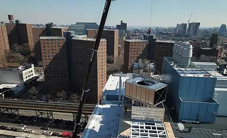 New cooling towers being loaded onto the roof of the Jerome L. Greene Science Center.