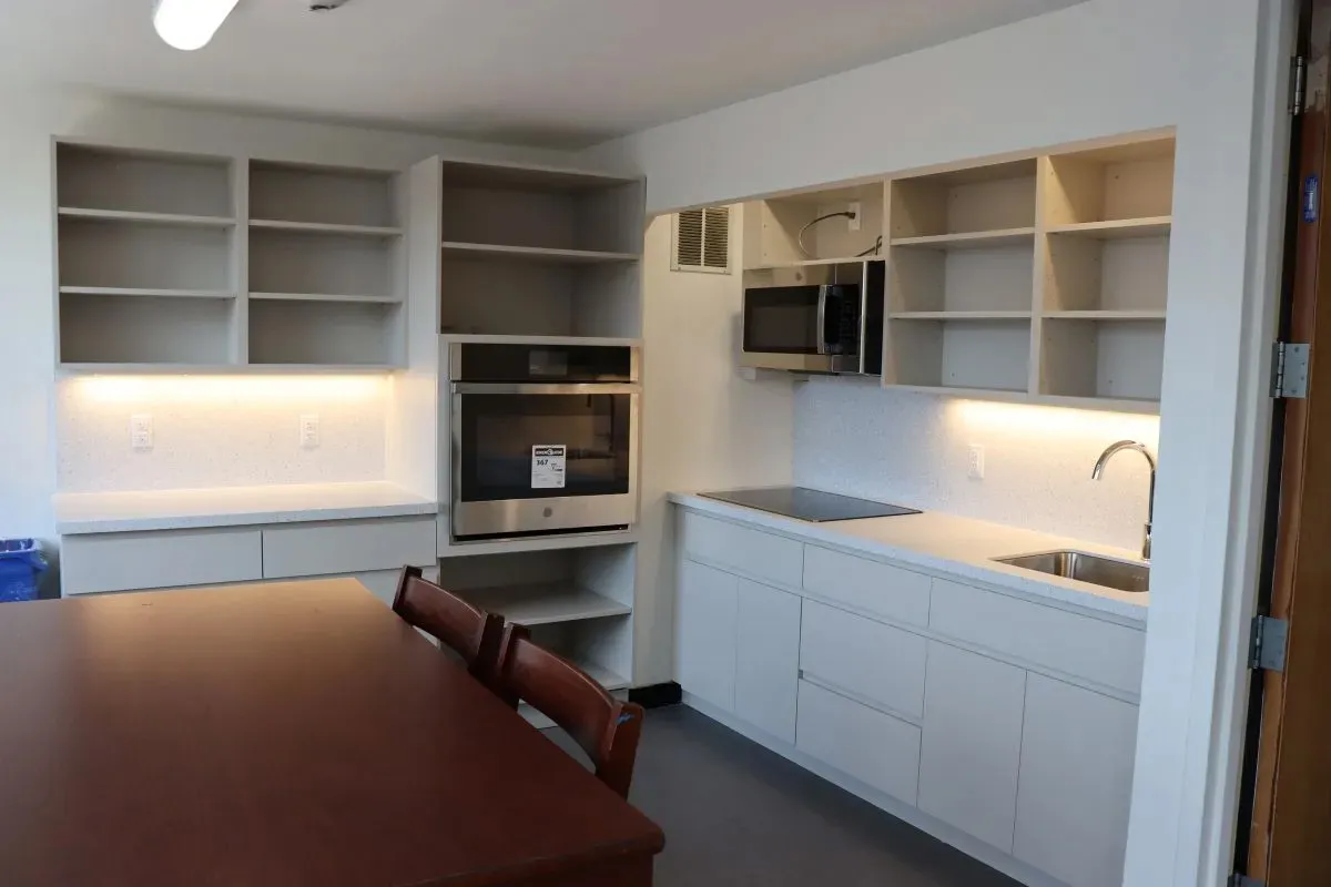 A pantry in Schaprio Hall with new gray flooring.