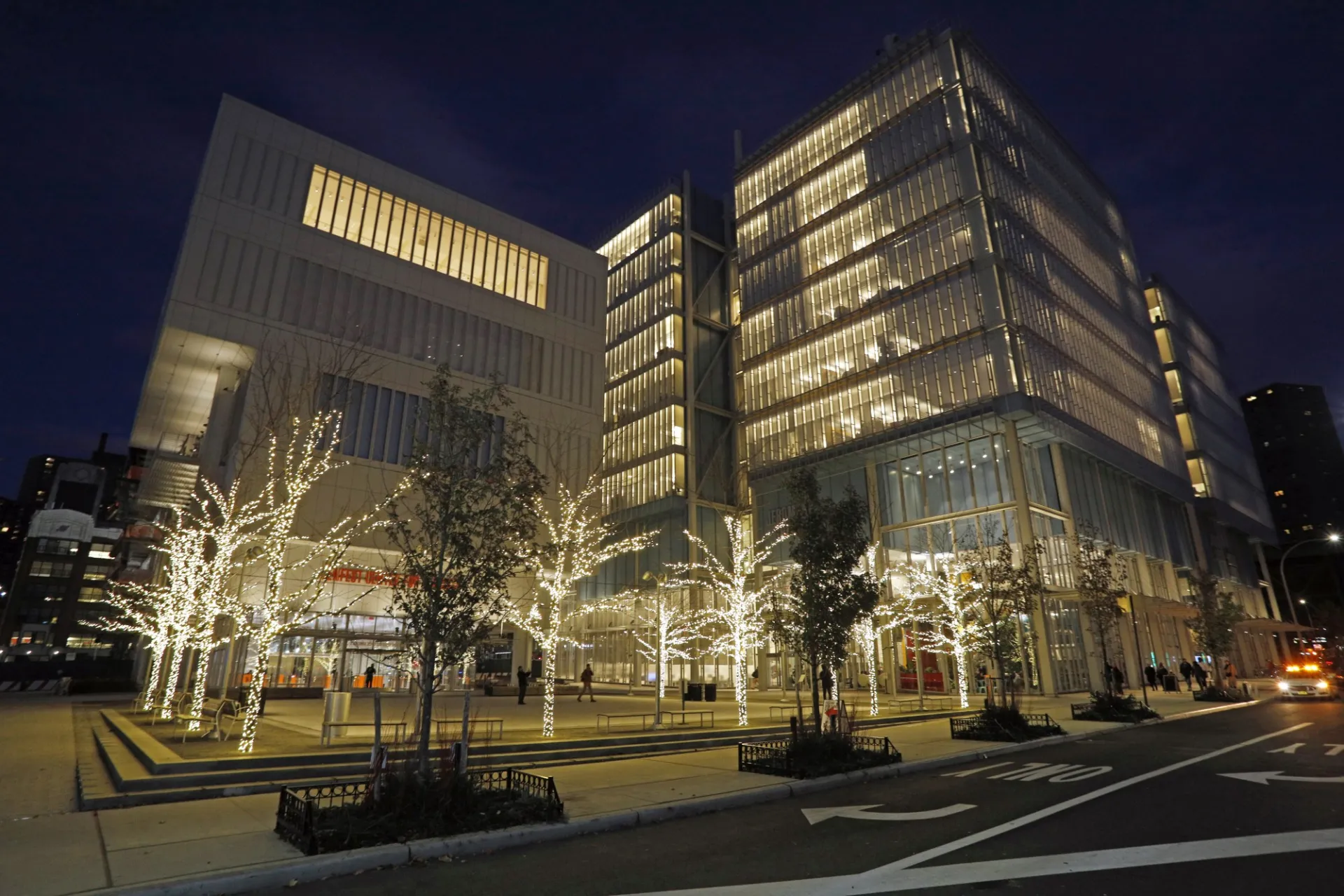 The trees atThe Plaza are illuminated with LED lights during the evening, with Lenfest Center for the Arts and Jerome L. Greene Science Center in the background.