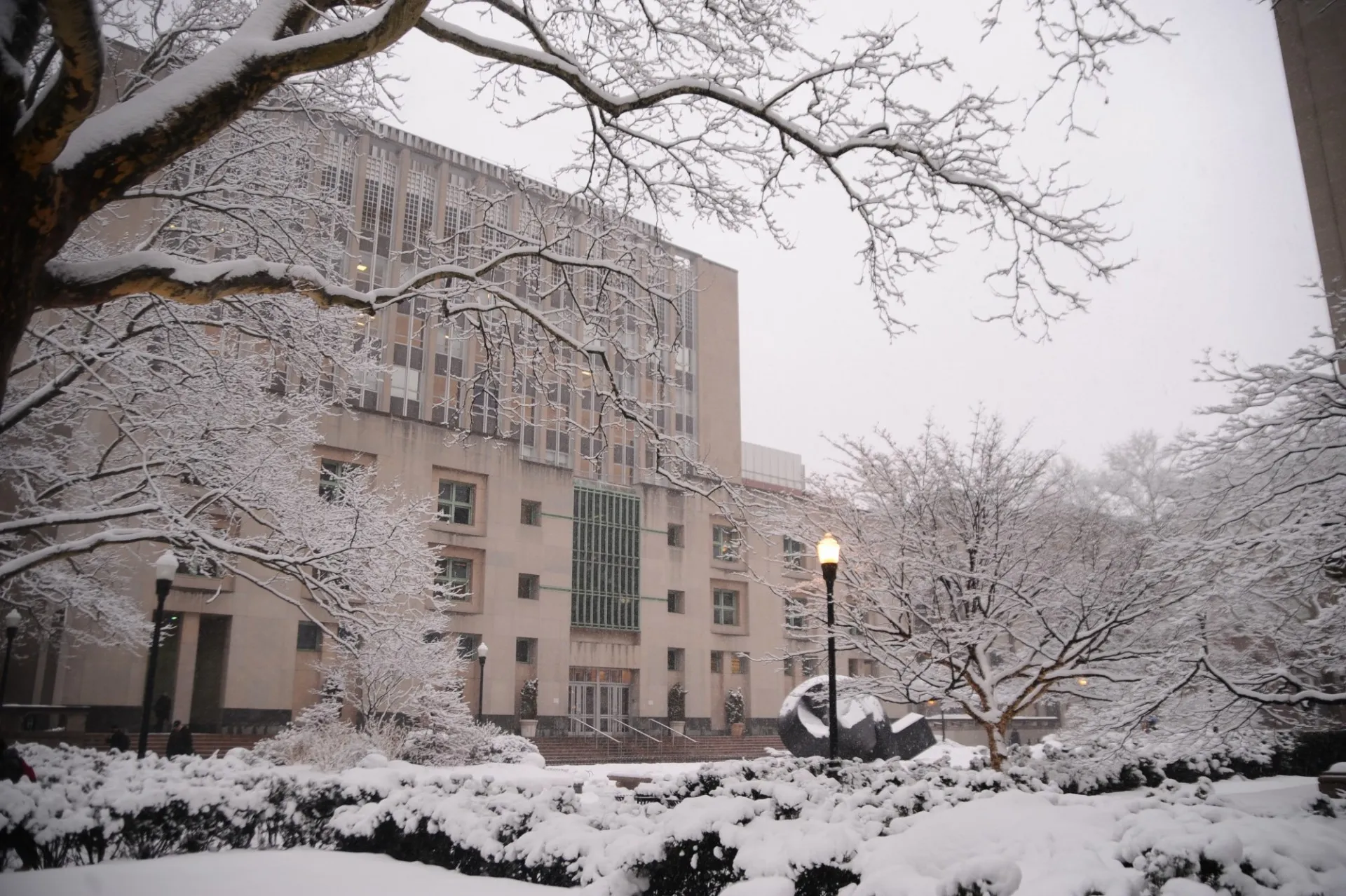 A view of Uris Hall during a snowy day.